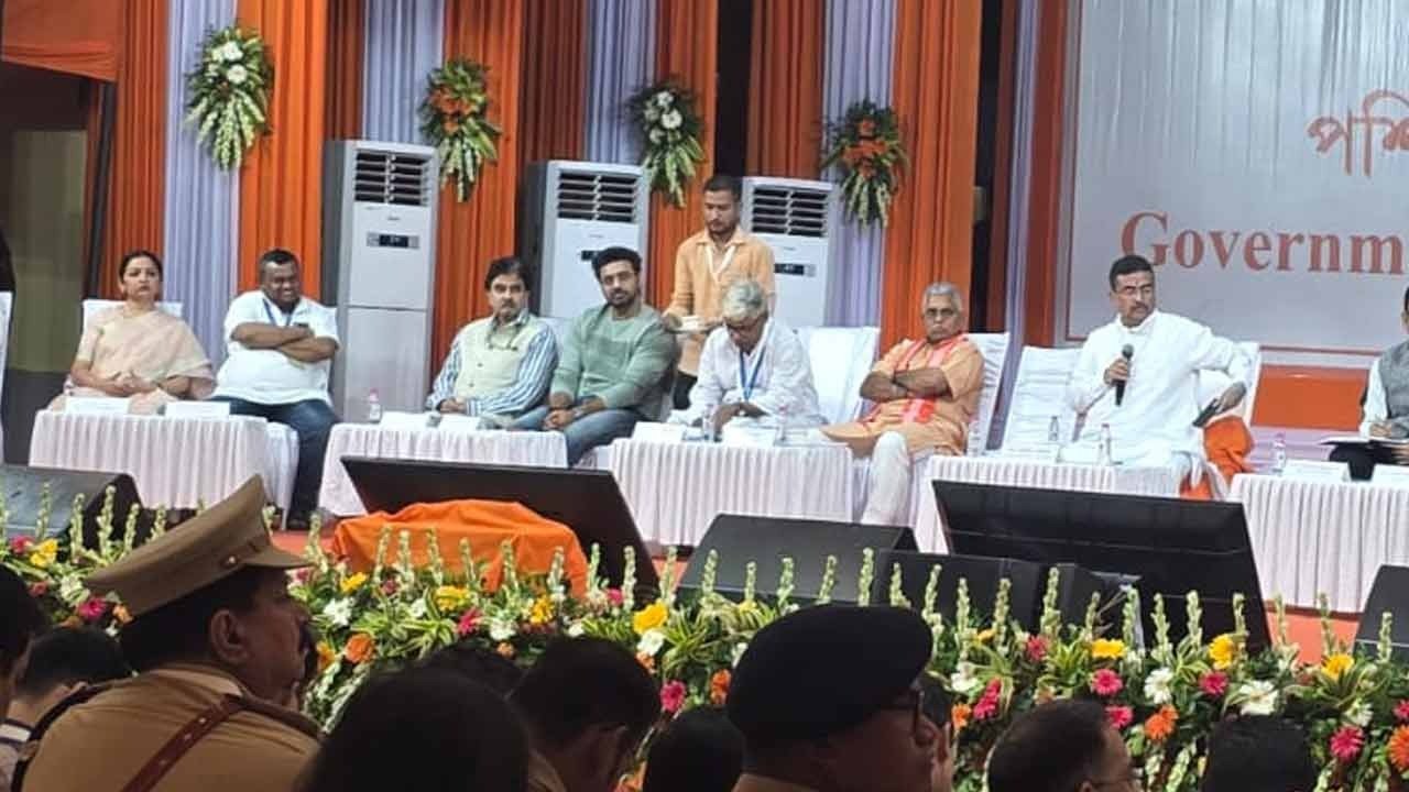 West Bengal Chief Minister Suvendu Adhikari and other officials attend a government event in Kakdwip, with the Chief Minister addressing the audience from the stage.