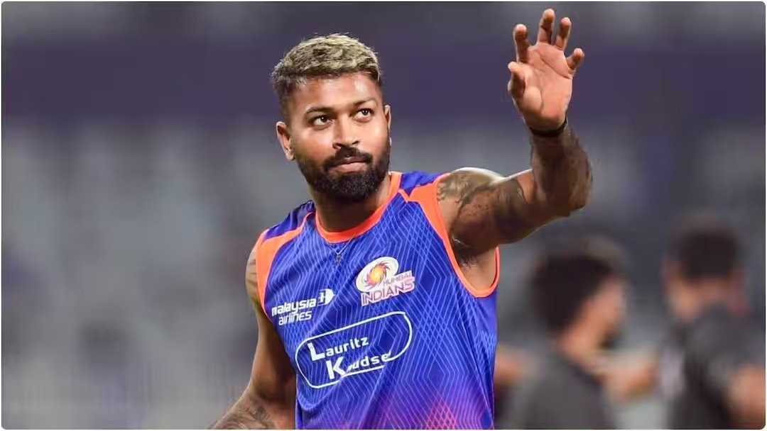Hardik Pandya in Mumbai Indians training jersey waving to fans during IPL practice session