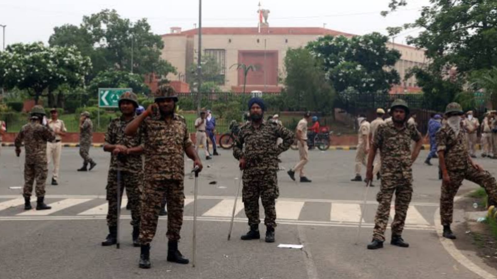 Security forces deployed outside New Parliament building in New Delhi after security alert